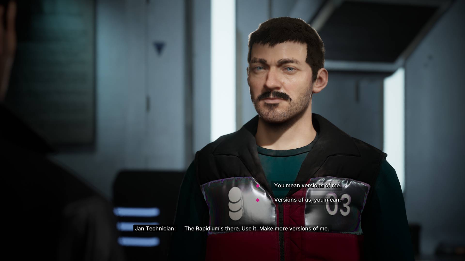 Jan Technician stands in the base in The Alters with dialogue on screen reading "The Rapidium's there. Use it. Make more versions of me."